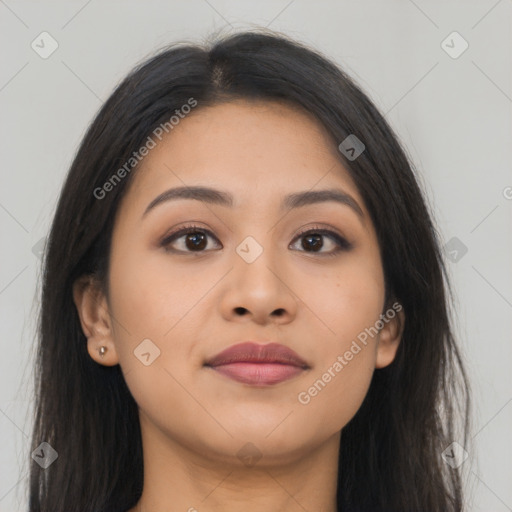 Joyful asian young-adult female with long  brown hair and brown eyes