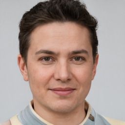 Joyful white young-adult male with short  brown hair and brown eyes