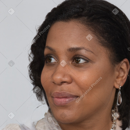 Joyful black adult female with short  brown hair and brown eyes