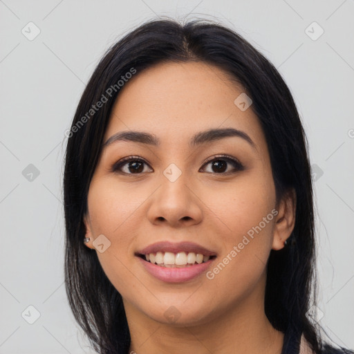 Joyful asian young-adult female with long  black hair and brown eyes