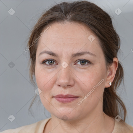 Joyful white adult female with medium  brown hair and grey eyes