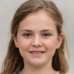 Joyful white child female with medium  brown hair and grey eyes