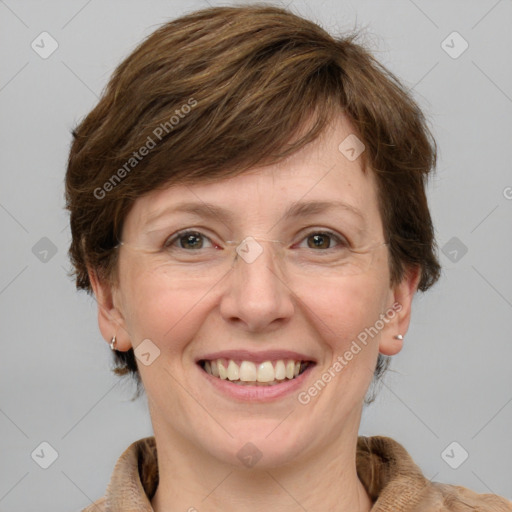 Joyful white adult female with medium  brown hair and grey eyes