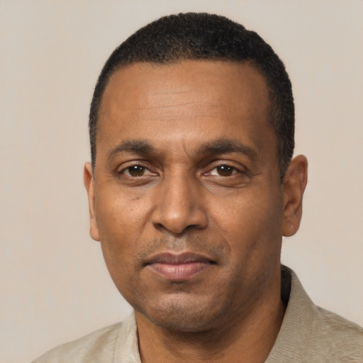 Neutral black adult male with short  black hair and brown eyes