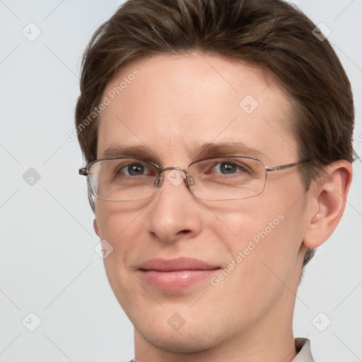 Joyful white adult male with short  brown hair and grey eyes