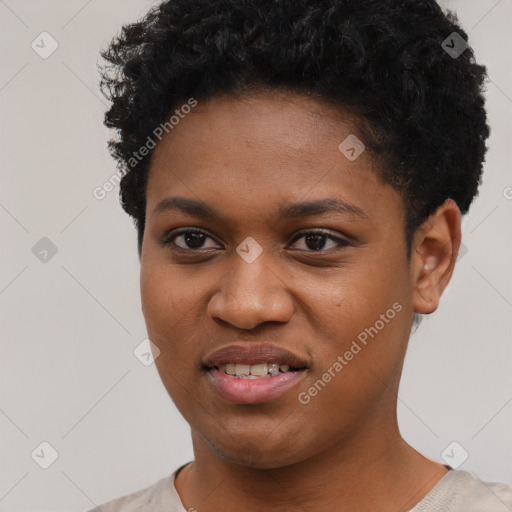 Joyful black young-adult female with short  black hair and brown eyes