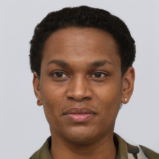 Joyful black young-adult male with short  black hair and brown eyes
