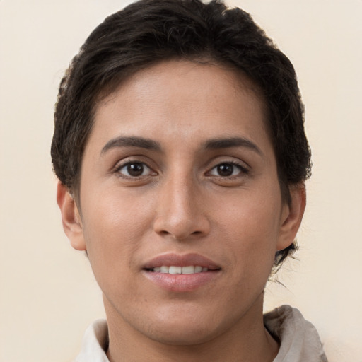 Joyful white young-adult female with short  brown hair and brown eyes