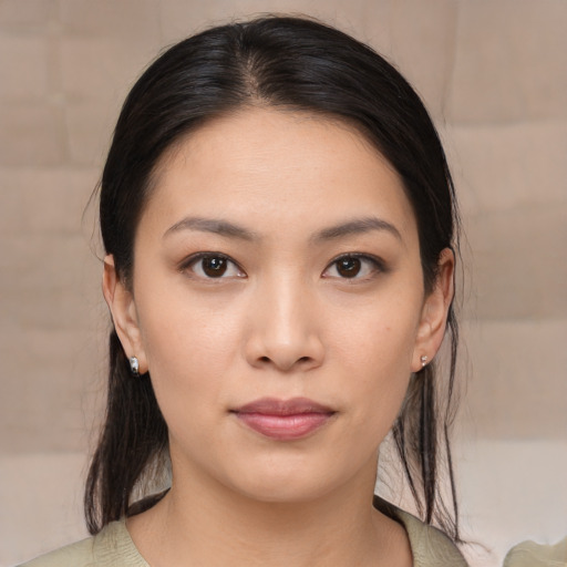 Joyful asian young-adult female with medium  brown hair and brown eyes