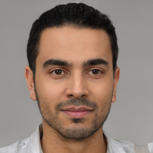 Neutral latino young-adult male with short  black hair and brown eyes
