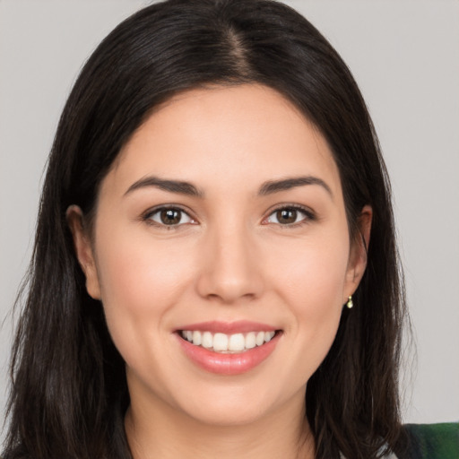 Joyful white young-adult female with long  brown hair and brown eyes