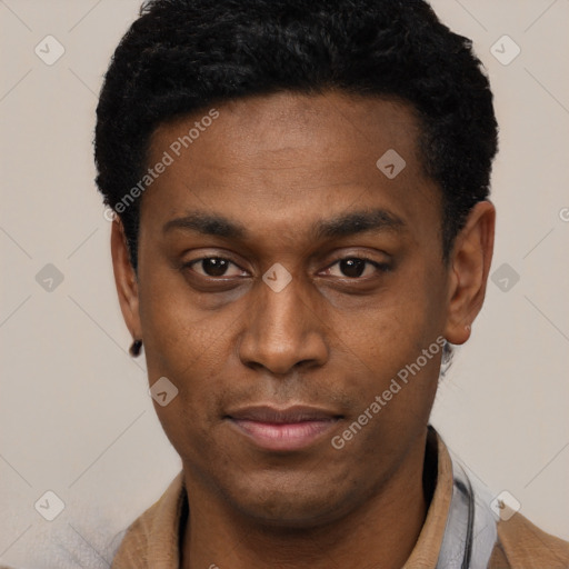 Joyful black young-adult male with short  black hair and brown eyes