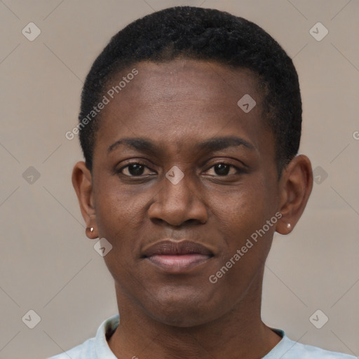 Joyful black young-adult male with short  black hair and brown eyes