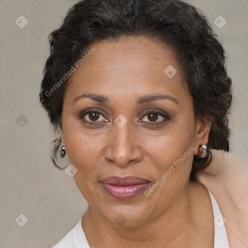 Joyful black adult female with short  brown hair and brown eyes