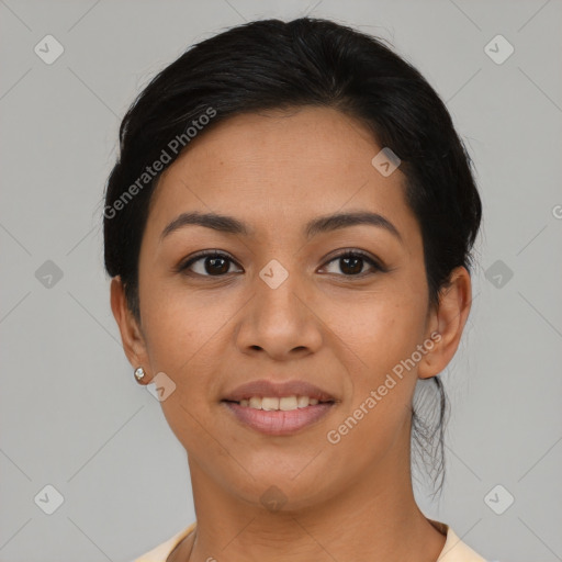 Joyful latino young-adult female with short  black hair and brown eyes