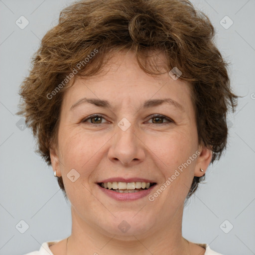 Joyful white adult female with short  brown hair and brown eyes