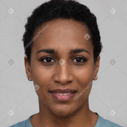 Joyful black young-adult female with short  black hair and brown eyes