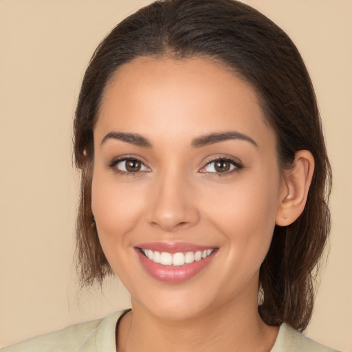 Joyful white young-adult female with medium  brown hair and brown eyes