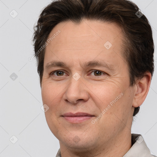 Joyful white adult male with short  brown hair and brown eyes