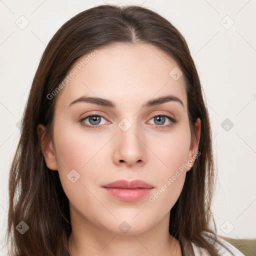 Neutral white young-adult female with long  brown hair and brown eyes