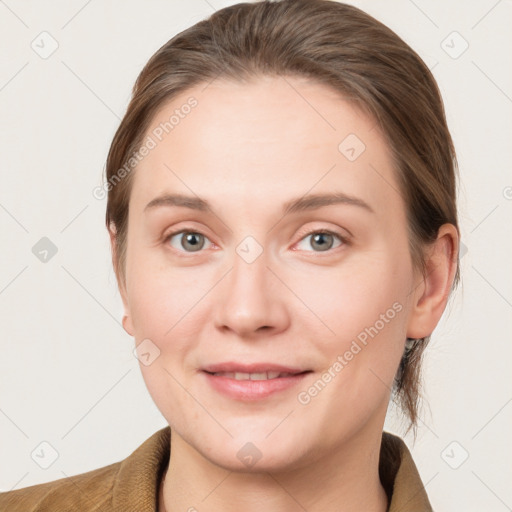 Joyful white young-adult female with medium  brown hair and blue eyes