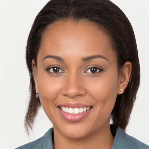 Joyful white young-adult female with long  brown hair and brown eyes