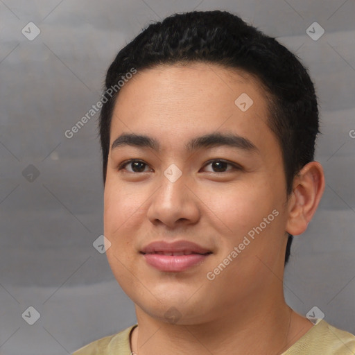 Joyful asian young-adult male with short  black hair and brown eyes