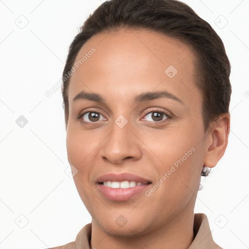 Joyful white young-adult female with long  brown hair and brown eyes