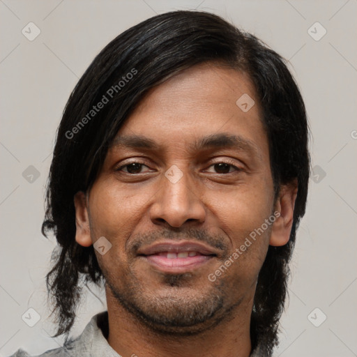 Joyful black young-adult male with medium  black hair and brown eyes