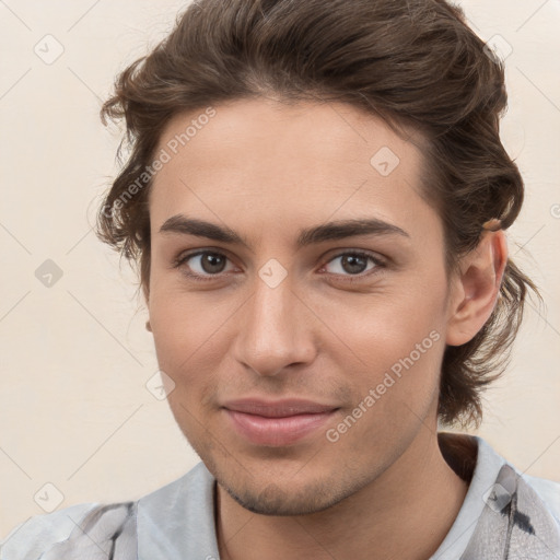 Joyful white young-adult male with medium  brown hair and brown eyes