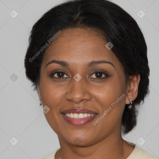 Joyful black adult female with medium  brown hair and brown eyes