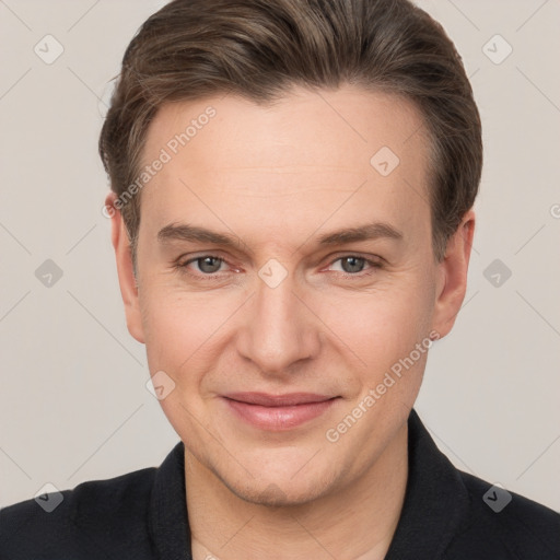 Joyful white adult male with short  brown hair and grey eyes