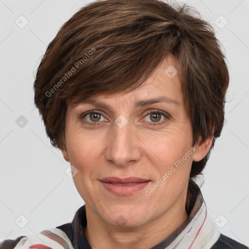 Joyful white adult female with medium  brown hair and grey eyes