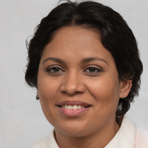 Joyful white adult female with medium  brown hair and brown eyes
