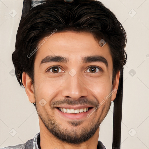 Joyful white young-adult male with short  black hair and brown eyes