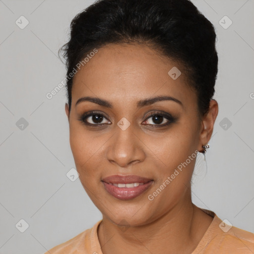Joyful black young-adult female with short  black hair and brown eyes