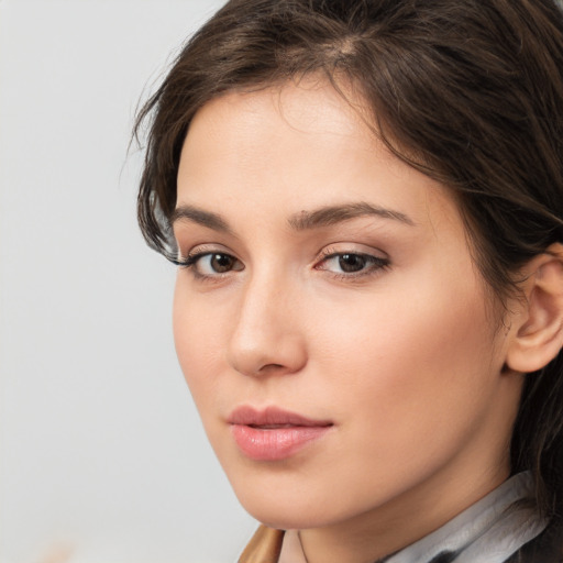 Neutral white young-adult female with medium  brown hair and brown eyes