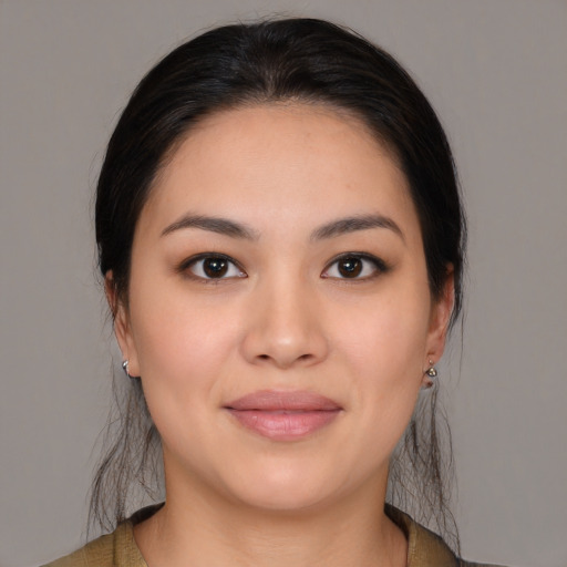 Joyful white young-adult female with medium  brown hair and brown eyes