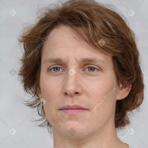 Joyful white adult female with medium  brown hair and green eyes