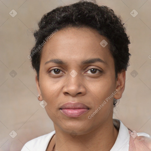 Joyful black adult female with short  brown hair and brown eyes