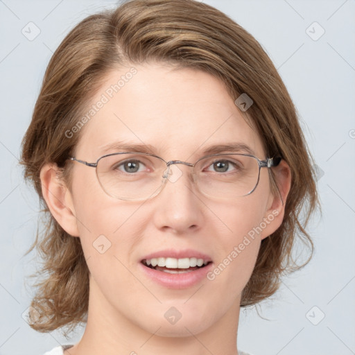 Joyful white adult female with medium  brown hair and grey eyes