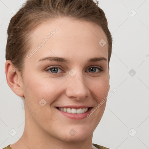 Joyful white young-adult female with short  brown hair and grey eyes