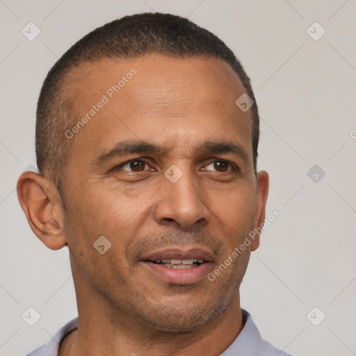 Joyful latino adult male with short  brown hair and brown eyes