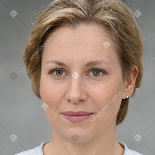 Joyful white adult female with medium  brown hair and grey eyes