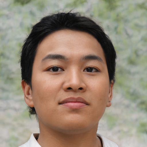 Joyful asian young-adult male with short  brown hair and brown eyes