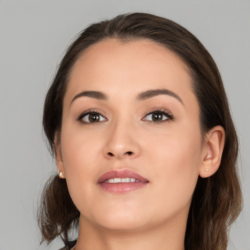 Joyful white young-adult female with medium  brown hair and brown eyes