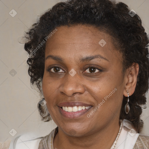 Joyful black adult female with medium  brown hair and brown eyes