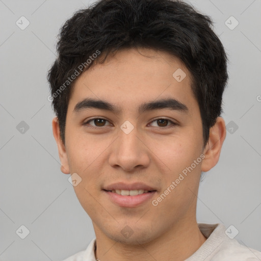 Joyful asian young-adult male with short  brown hair and brown eyes