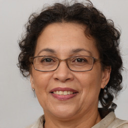 Joyful white middle-aged female with medium  brown hair and brown eyes