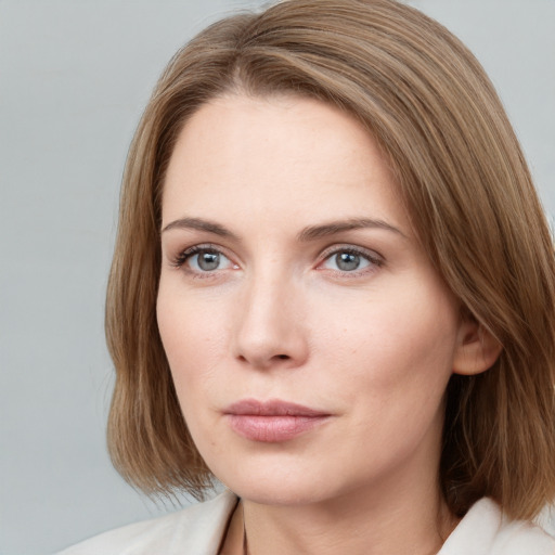 Neutral white young-adult female with medium  brown hair and blue eyes